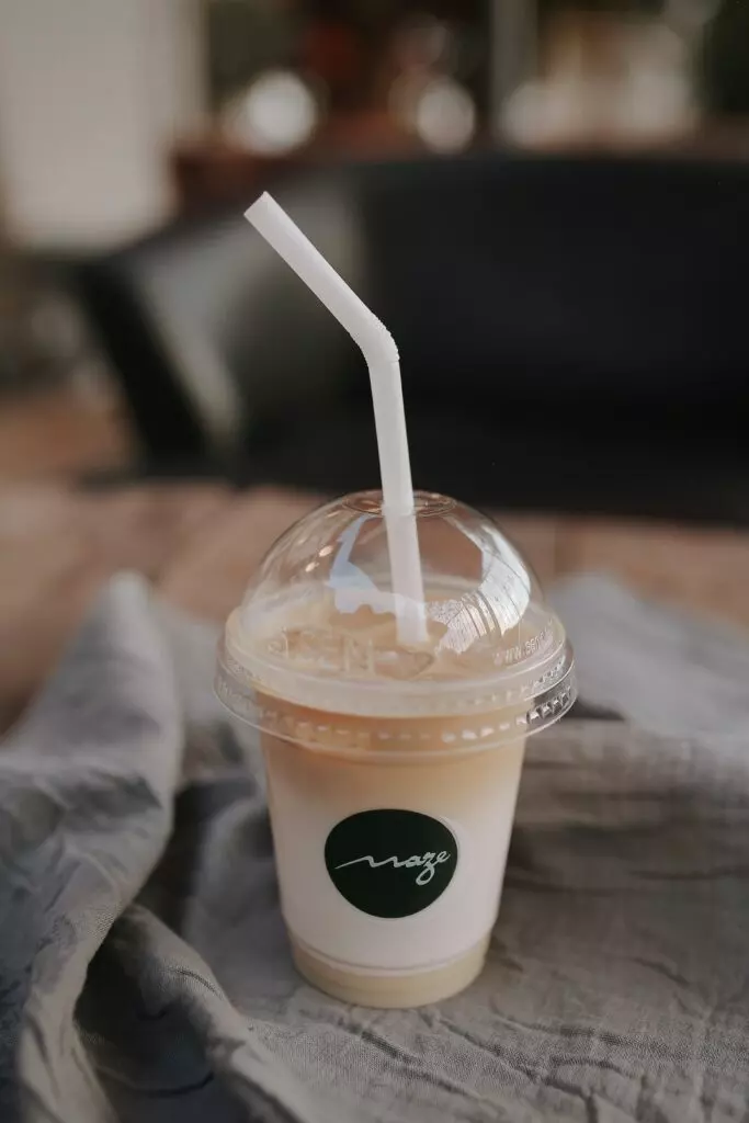 single plastic cup with straw